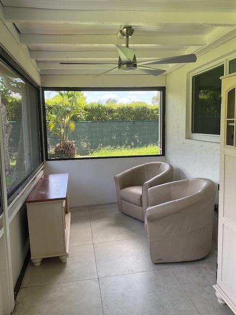 224 Cardinal Lane Delray Beach, FL 33445 - Photo 30 of 38 a living room with furniture and a large window