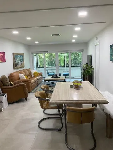 a view of a livingroom with furniture and window