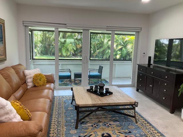 224 Cardinal Lane Delray Beach, FL 33445 - Photo 5 of 38 a living room with furniture and a flat screen tv
