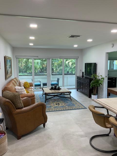 224 Cardinal Lane Delray Beach, FL 33445 - Photo 7 of 38 a living room with furniture and a large window