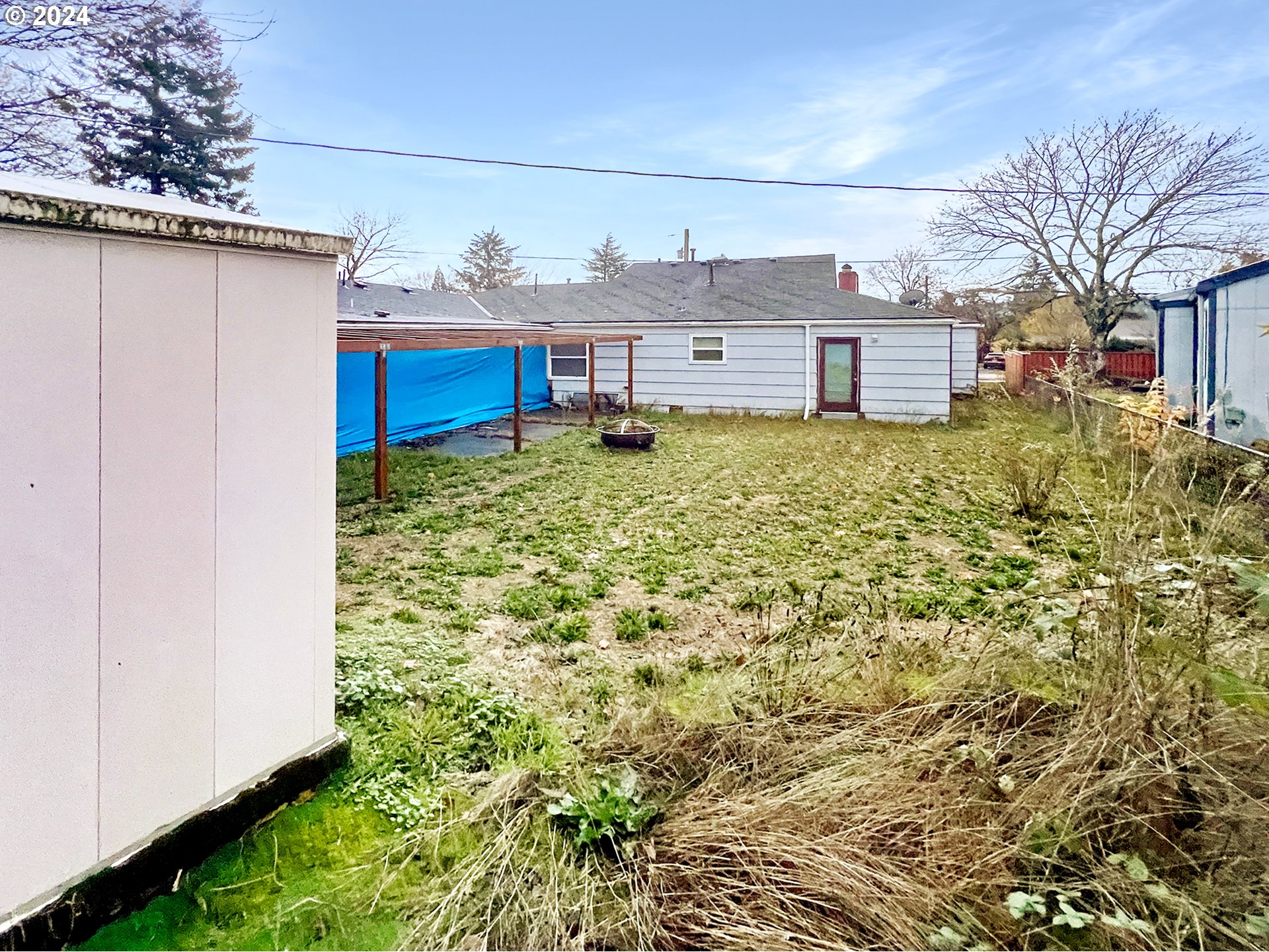 11535 Southeast Boise Street Portland, OR 97266 - Photo 5 of 10 a view of a backyard