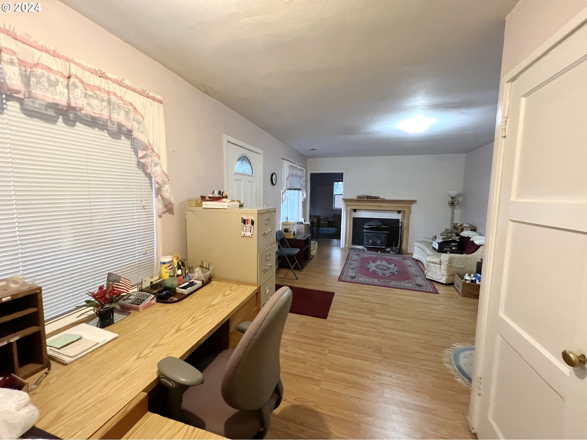 11535 Southeast Boise Street Portland, OR 97266 - Photo 6 of 10 a bedroom with furniture and a wooden floor
