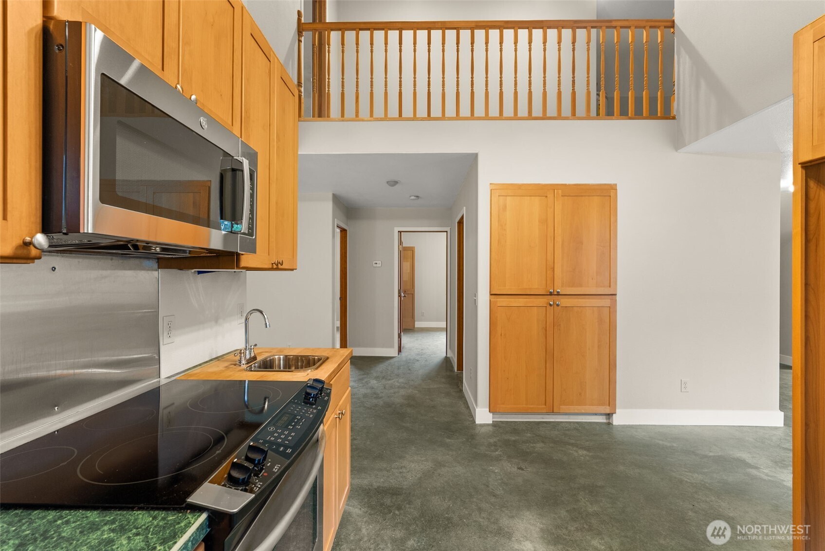 33 Rustemeyer Road Aberdeen, WA 98520 - Photo 17 of 39 a kitchen with stainless steel appliances a sink a stove and a microwave