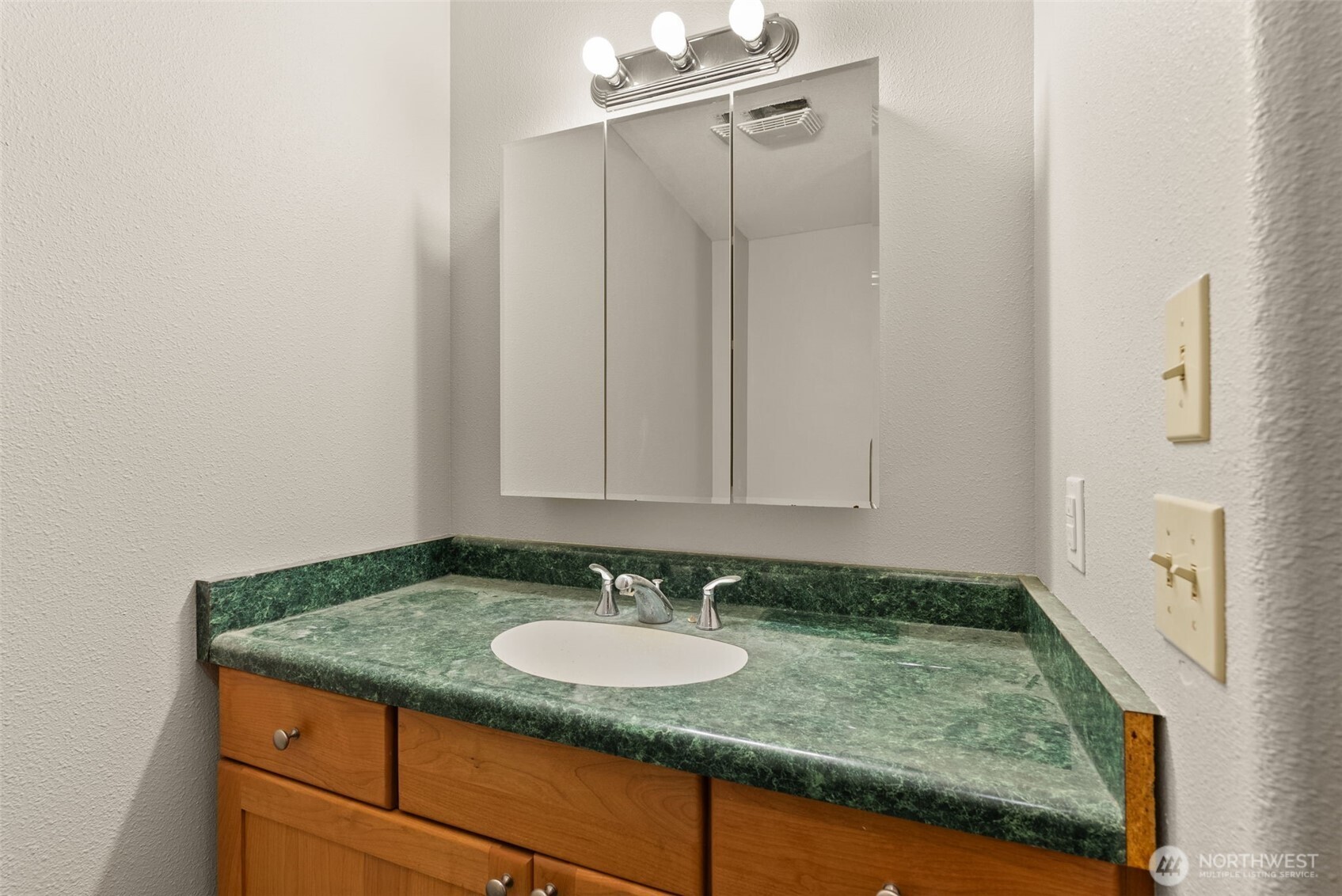 33 Rustemeyer Road Aberdeen, WA 98520 - Photo 24 of 39 a bathroom with a granite countertop sink and a mirror