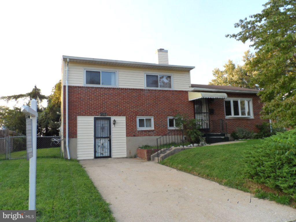 914 Bardswell Road Baltimore, MD 21228 - Photo 1 of 10 a front view of a house with a yard