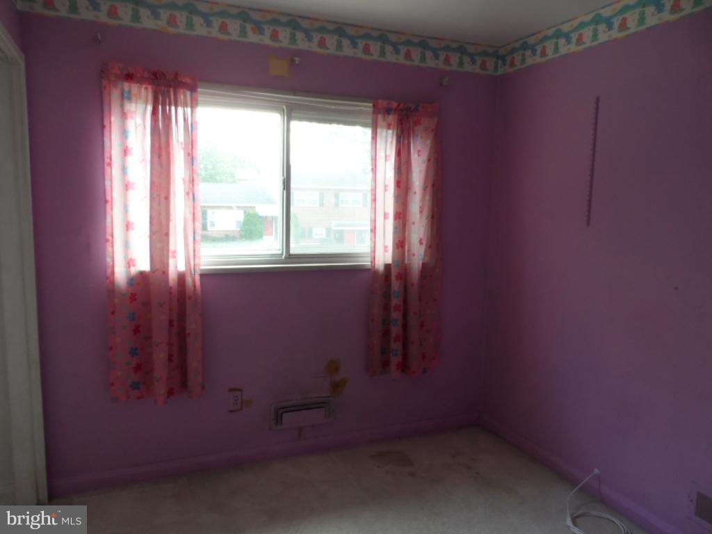 914 Bardswell Road Baltimore, MD 21228 - Photo 8 of 10 an empty room with a window