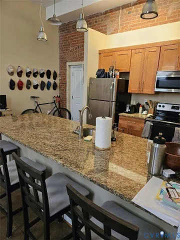 a kitchen with a table chairs and a stove
