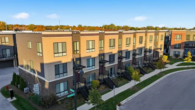 a view of multiple houses with a yard