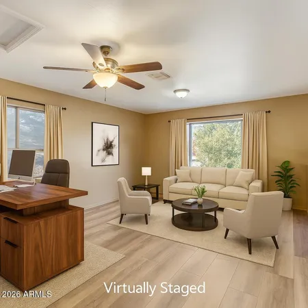 a living room with furniture and a window