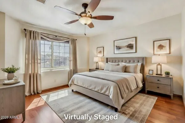 a spacious bedroom with a large bed and a window