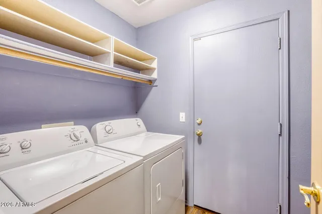 a utility room with dryer and washer