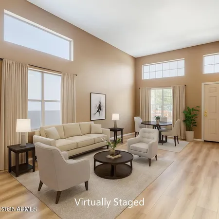 a living room with furniture and a large window