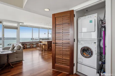 a spacious bathroom with a granite countertop sink a mirror and a shower