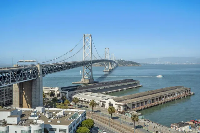 a kitchen with a sink a stove and cabinets