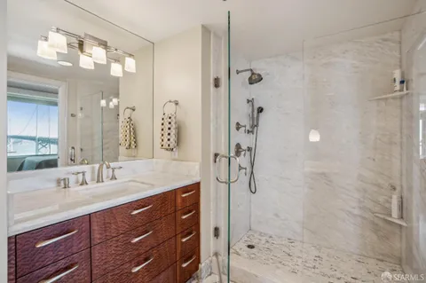 a bathroom with a tub and shower