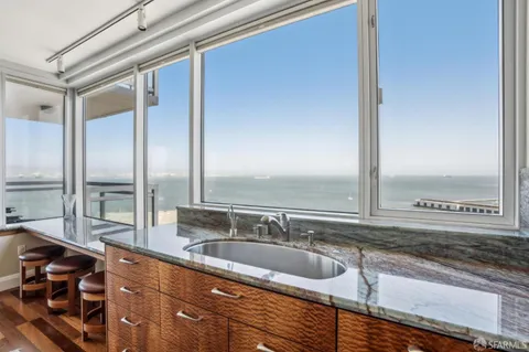 a bedroom with a bed and a night stand