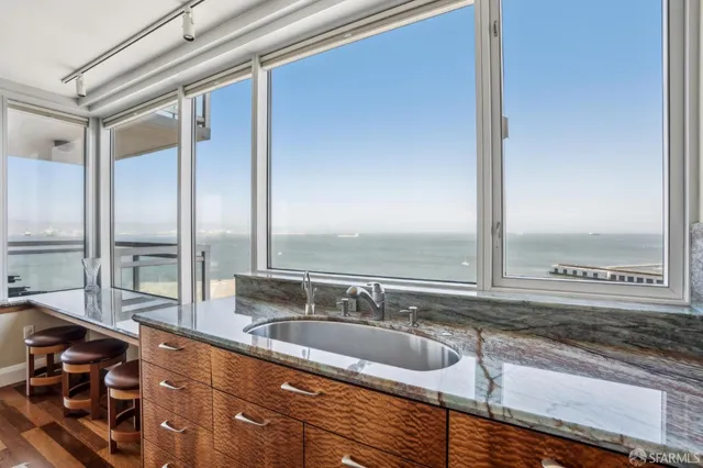 a bedroom with a bed and a night stand