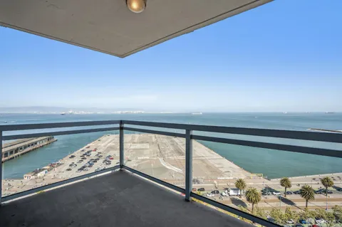 a bathroom with a double vanity sink mirror and shower