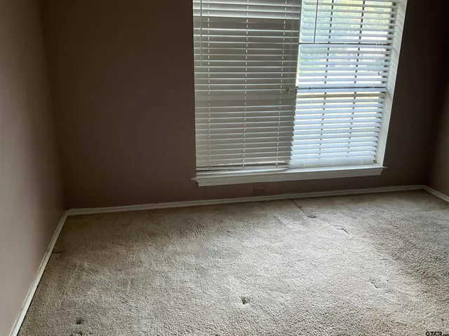 a view of a room that has a window in it