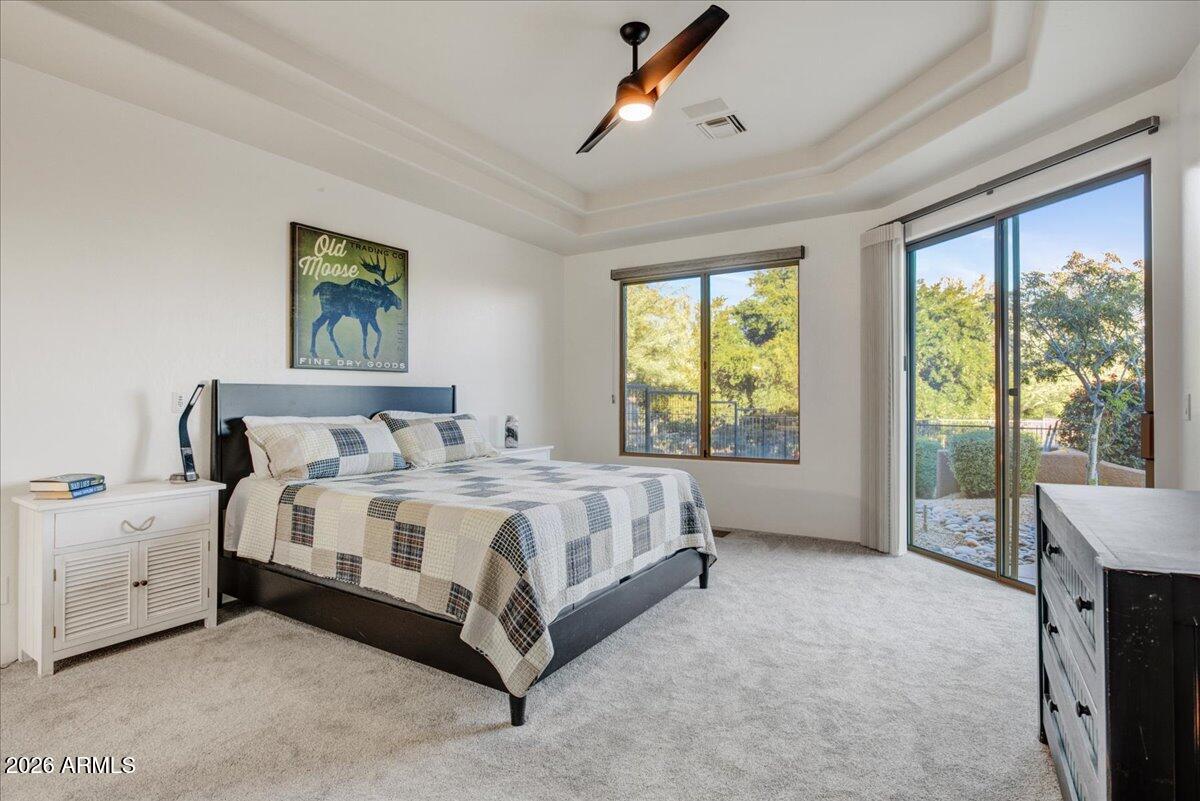 27901 Tranquilo Way Rio Verde, AZ 85263 - Photo 11 of 35 a spacious bedroom with a bed and a large window
