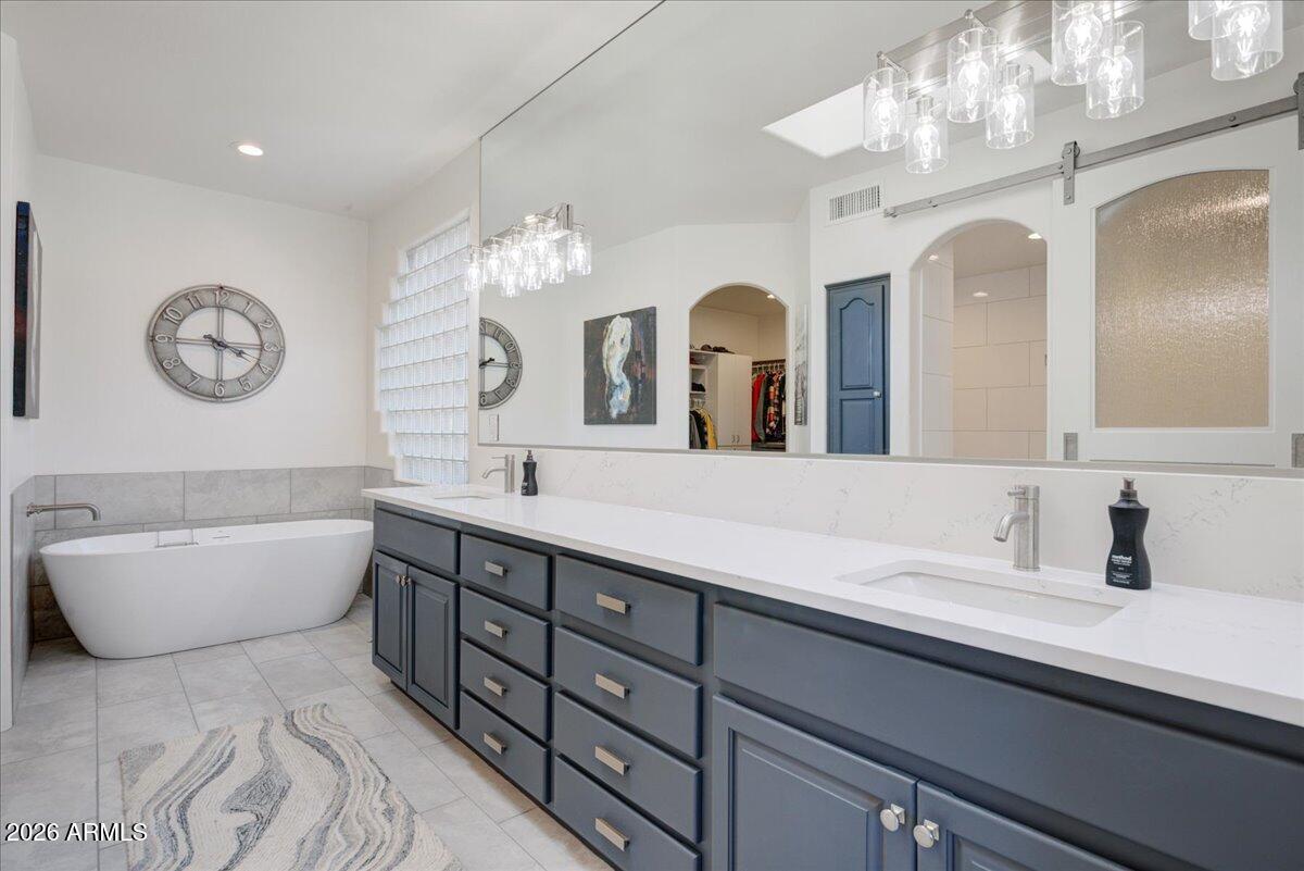 27901 Tranquilo Way Rio Verde, AZ 85263 - Photo 13 of 35 a bathroom with a double vanity sink mirror and bathtub