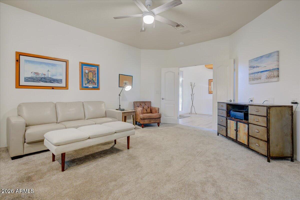 27901 Tranquilo Way Rio Verde, AZ 85263 - Photo 18 of 35 a living room with furniture and a chandelier