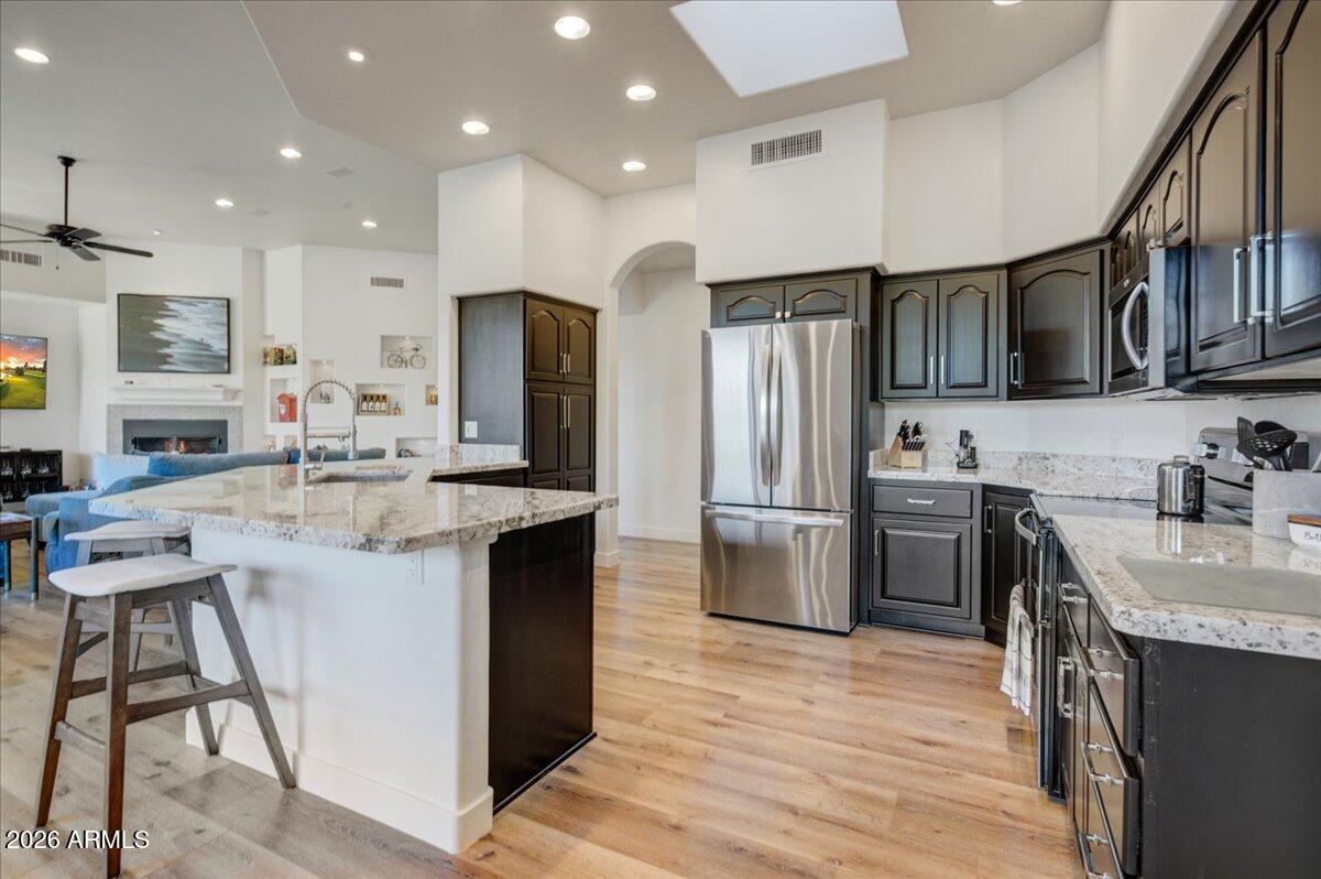 27901 Tranquilo Way Rio Verde, AZ 85263 - Photo 8 of 35 a kitchen with refrigerator and cabinets