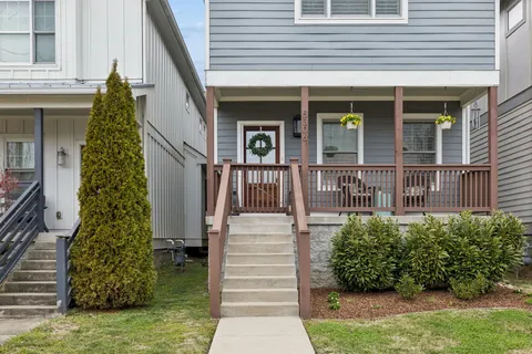 a front view of a house with garden