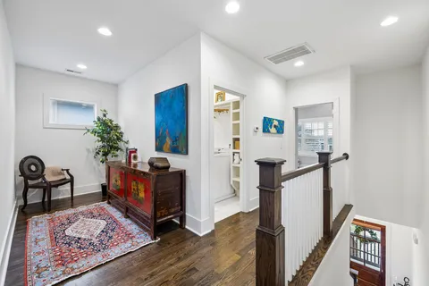 a bedroom with furniture and a flat screen tv