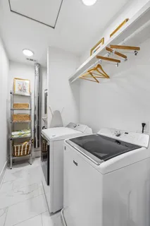 a bed room with couch and a window