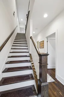 a bedroom with a bed and a table