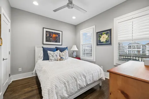 a bedroom with a bed and a dresser