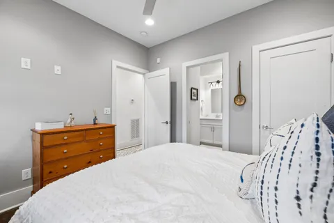 a bathroom with a granite countertop sink toilet a shower and a mirror