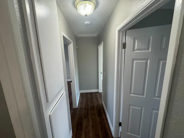 a view of a hallway and a mirror