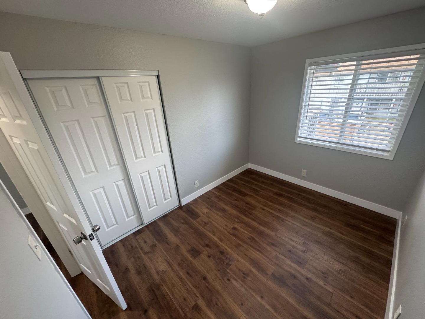 1051 Rider Avenue, Unit F Salinas, CA 93905 - Photo 17 of 23 a view of a room with wooden floor and window