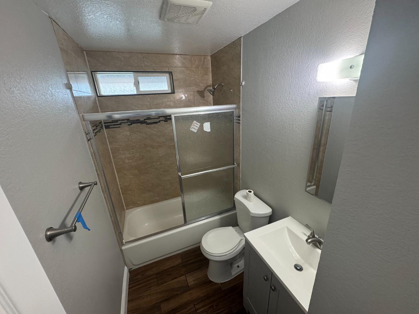 1051 Rider Avenue, Unit F Salinas, CA 93905 - Photo 23 of 23 a bathroom with a toilet a sink and shower