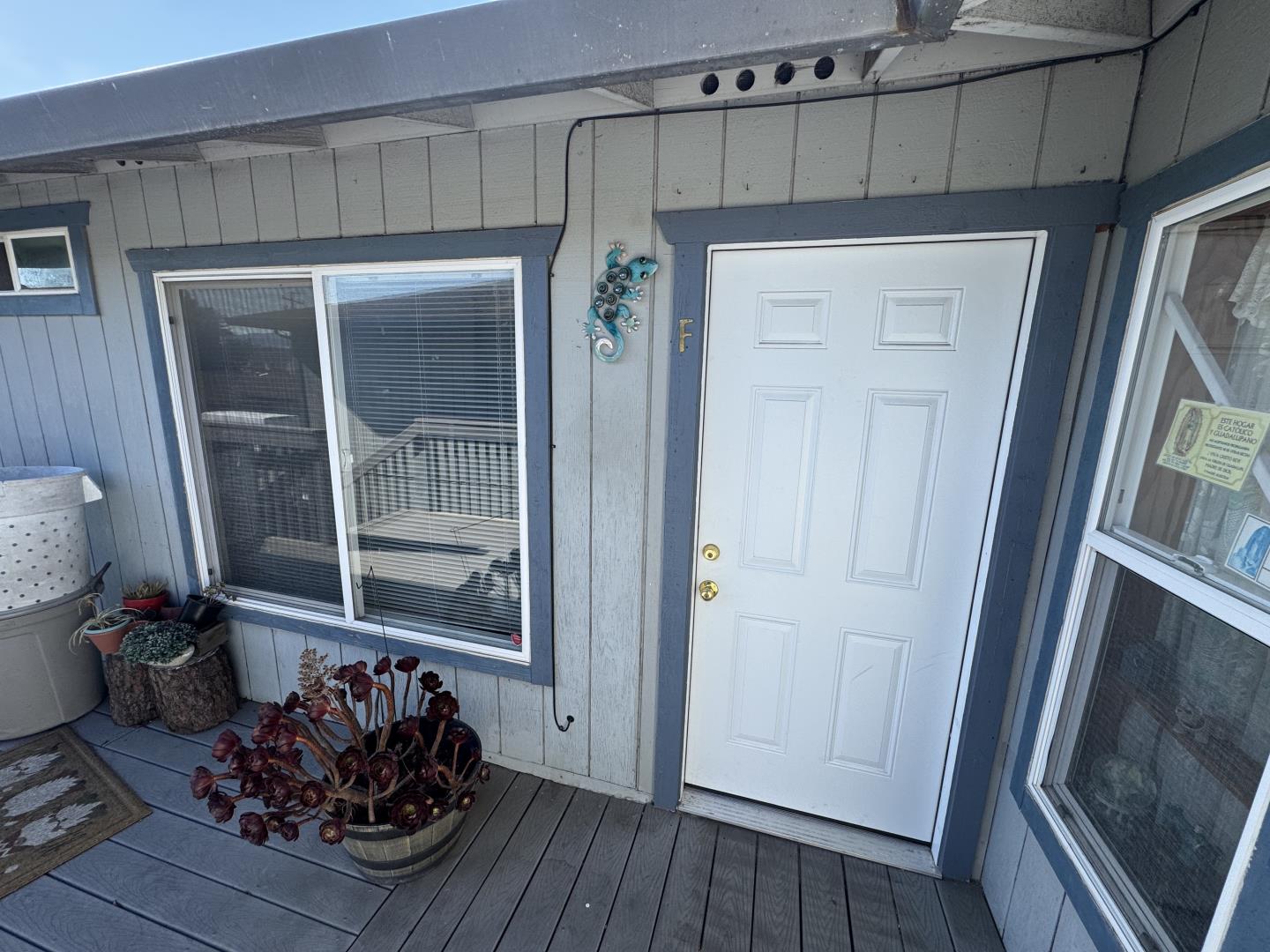 1051 Rider Avenue, Unit F Salinas, CA 93905 - Photo 3 of 23 a room with wooden floor and a mirror