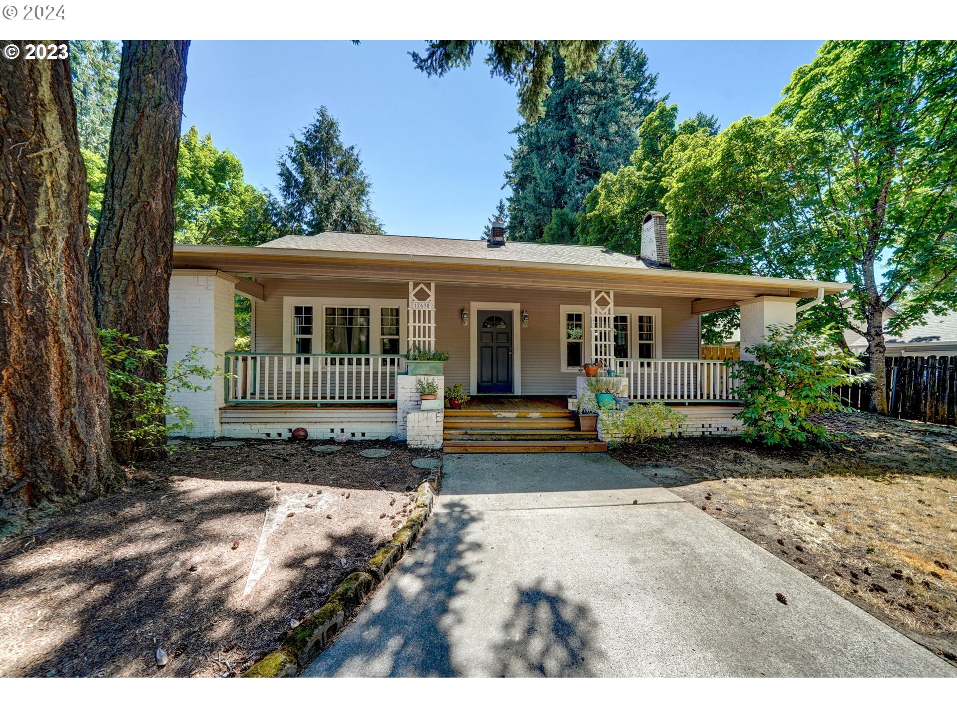 12638 Southeast Foster Road, Unit 12 Portland, OR 97236 - Photo 1 of 32 a view of a house with a yard