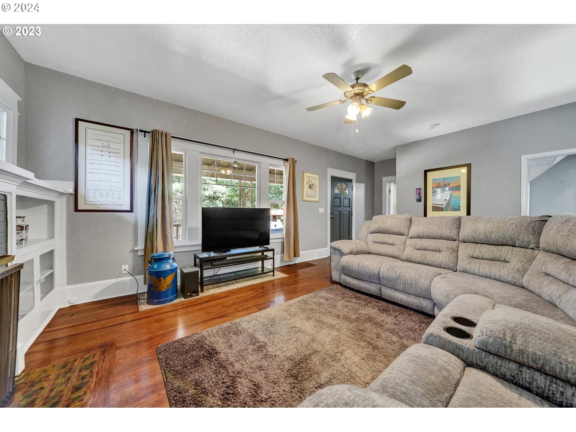 12638 Southeast Foster Road, Unit 12 Portland, OR 97236 - Photo 22 of 32 a living room with furniture and a flat screen tv