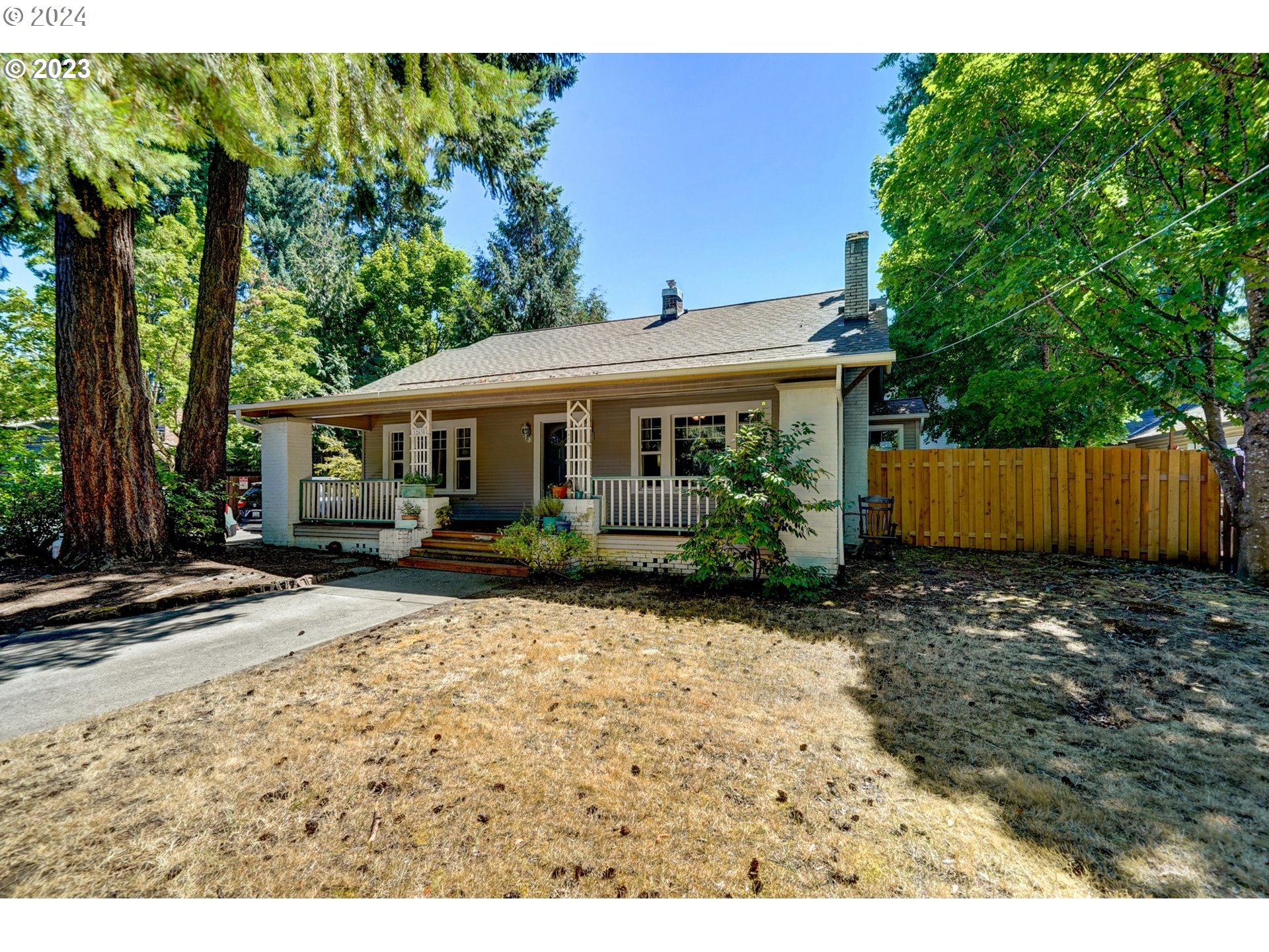 12638 Southeast Foster Road, Unit 12 Portland, OR 97236 - Photo 3 of 32 a view of a house with a yard