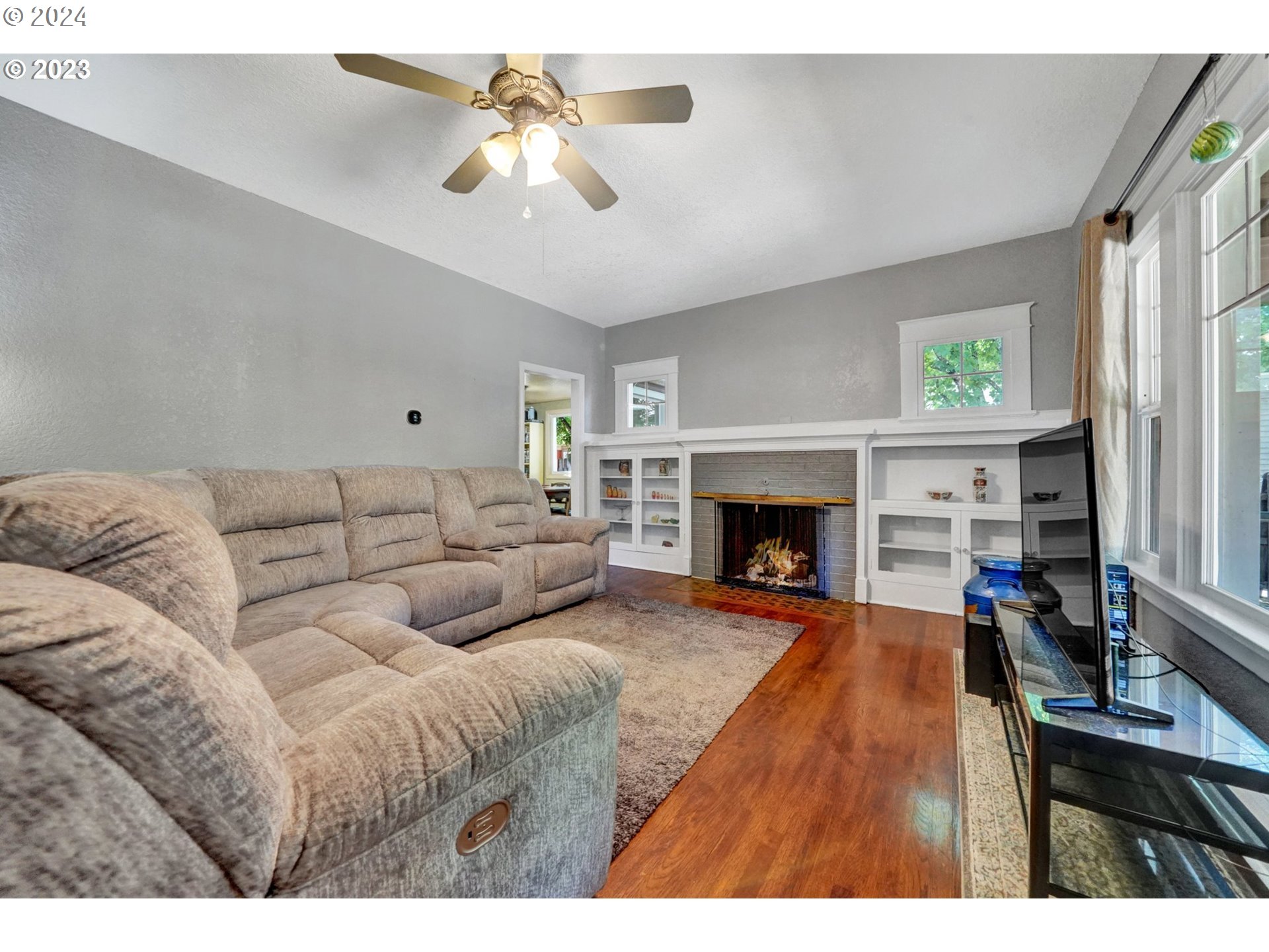 12638 Southeast Foster Road, Unit 12 Portland, OR 97236 - Photo 4 of 32 a living room with furniture and a fireplace