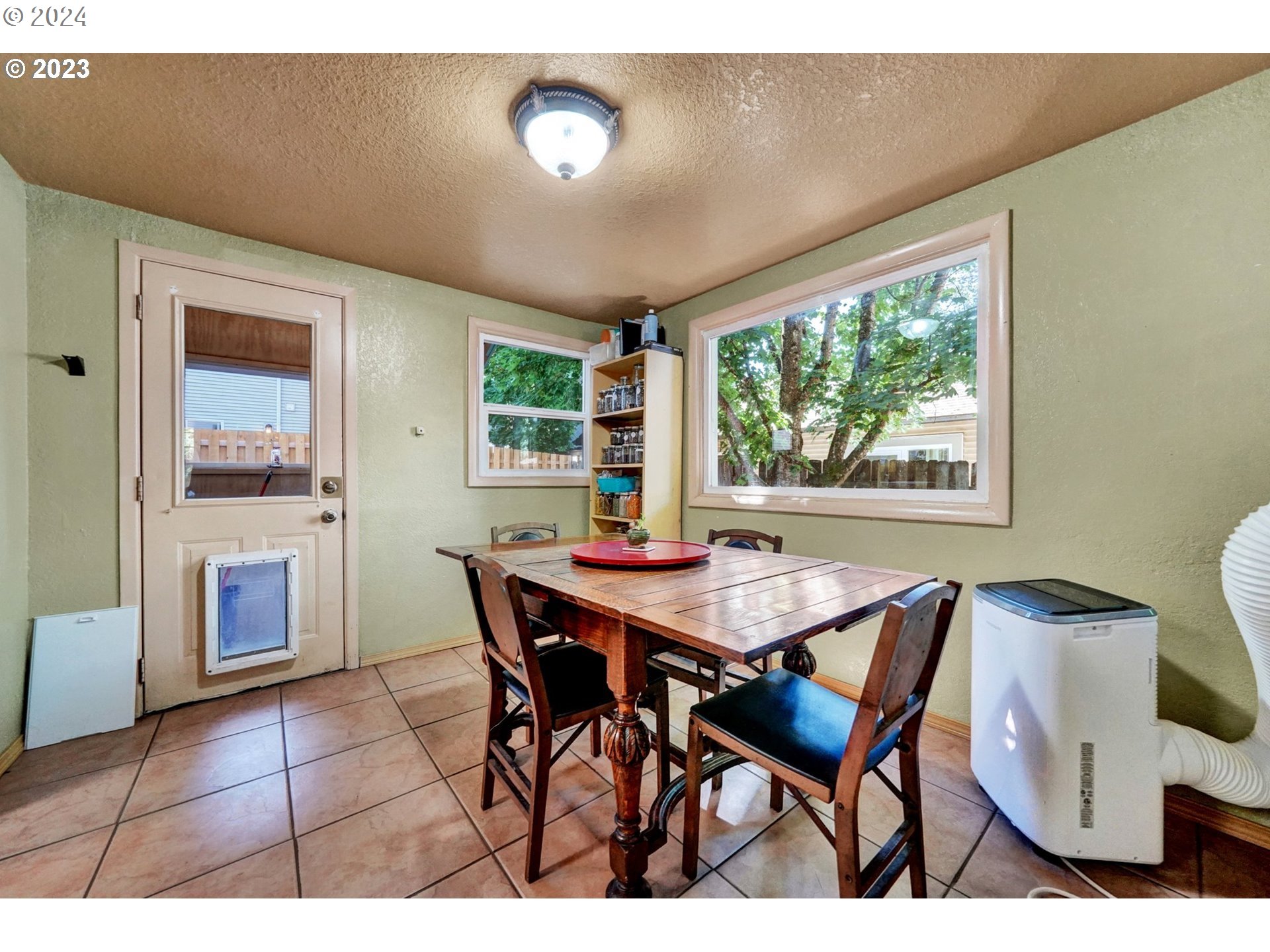 12638 Southeast Foster Road, Unit 12 Portland, OR 97236 - Photo 8 of 32 a view of a dining room with furniture window and outside view