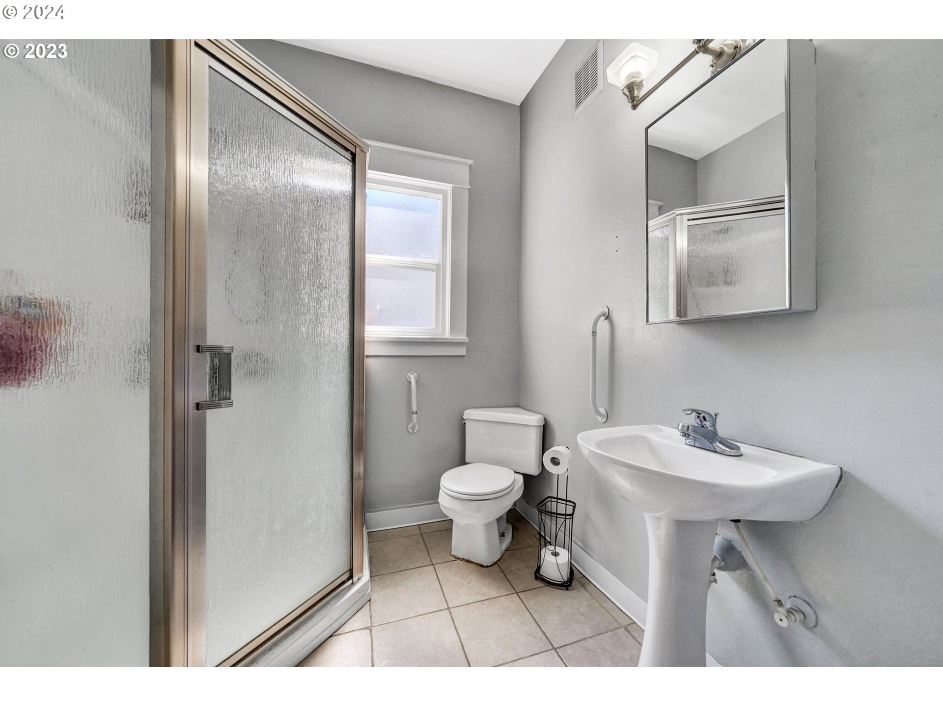 12638 Southeast Foster Road, Unit 12 Portland, OR 97236 - Photo 10 of 32 a bathroom with a sink toilet and mirror