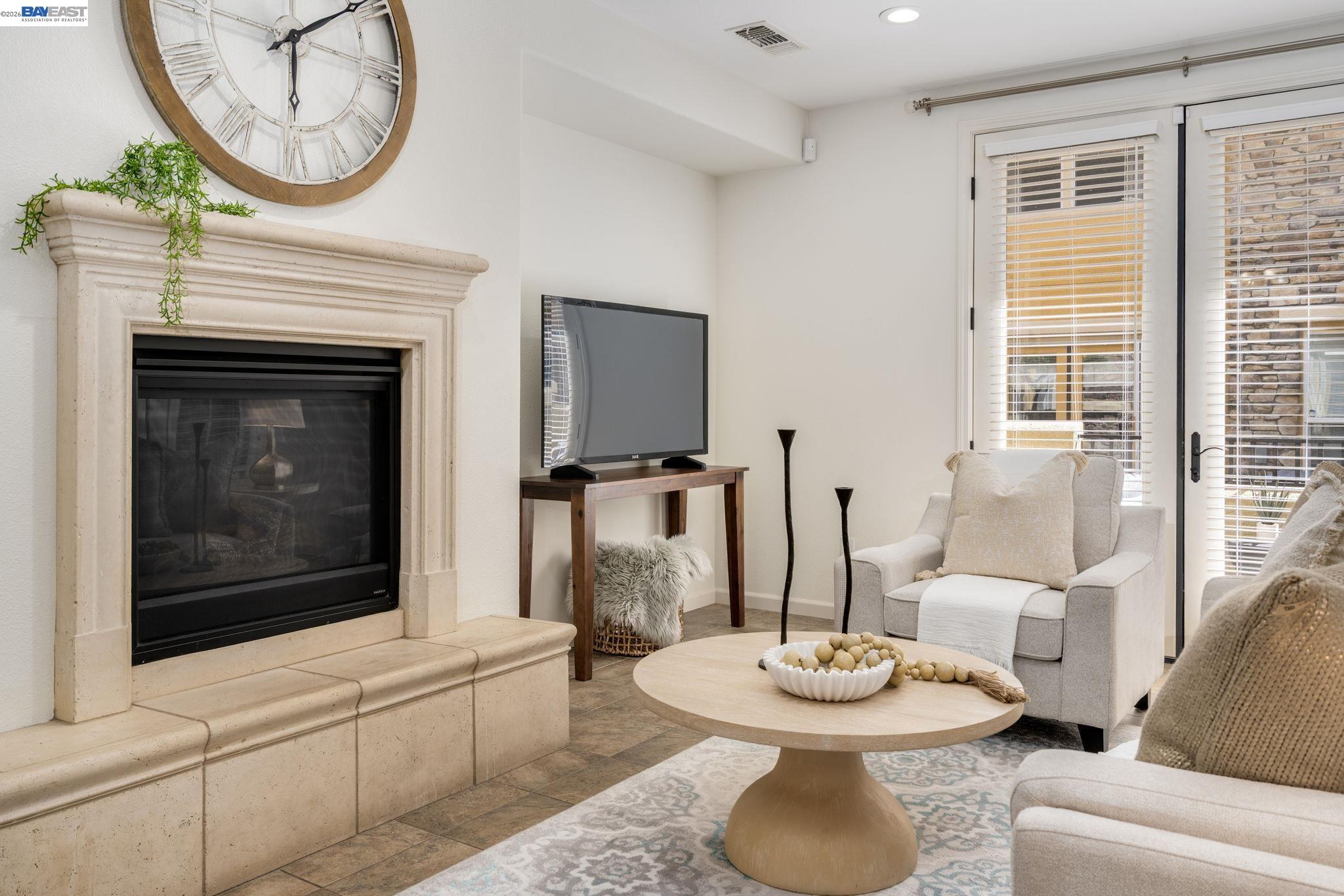 4653 Rimini Court Dublin, CA 94568 - Photo 9 of 44 a living room with furniture a front door and a fireplace