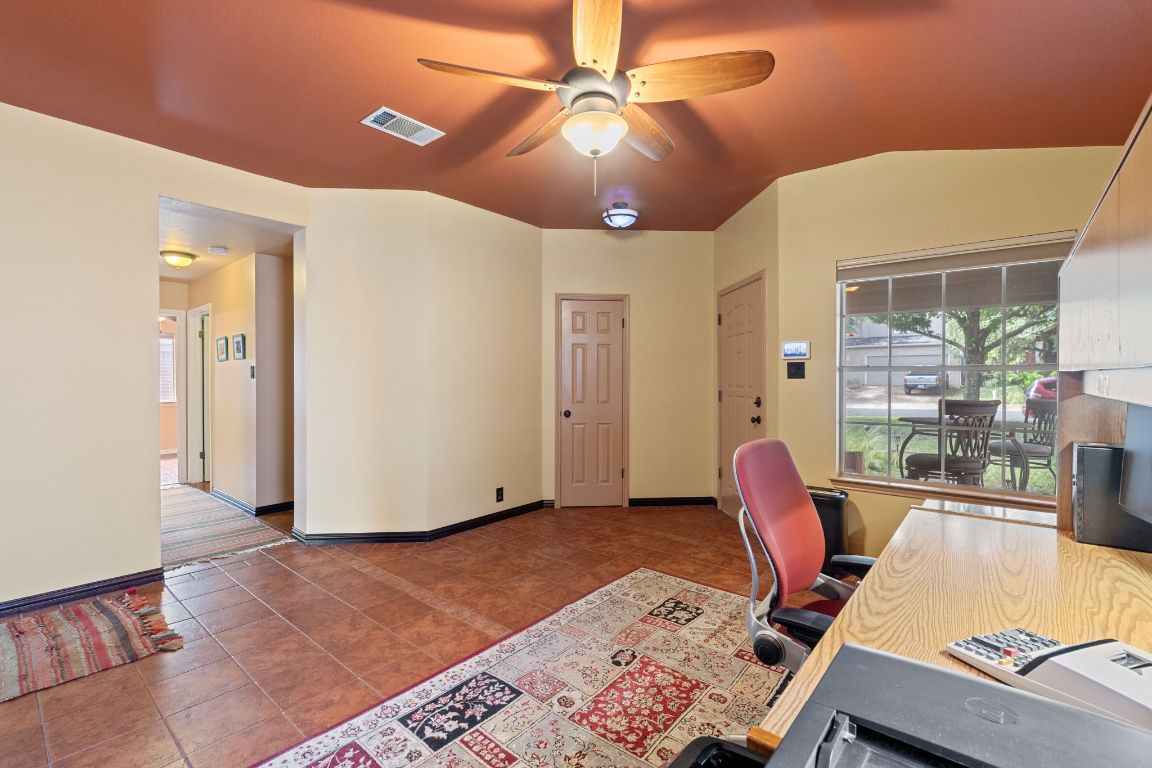 2114 Desco Drive Austin, TX 78748 - Photo 11 of 40 Tiled office with a ceiling fan, plenty of natural light, and baseboards
