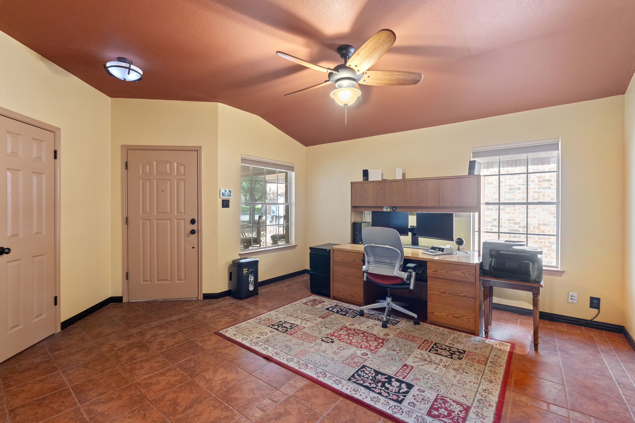 2114 Desco Drive Austin, TX 78748 - Photo 13 of 40 Office area featuring a ceiling fan, vaulted ceiling, tile patterned floors, and baseboards