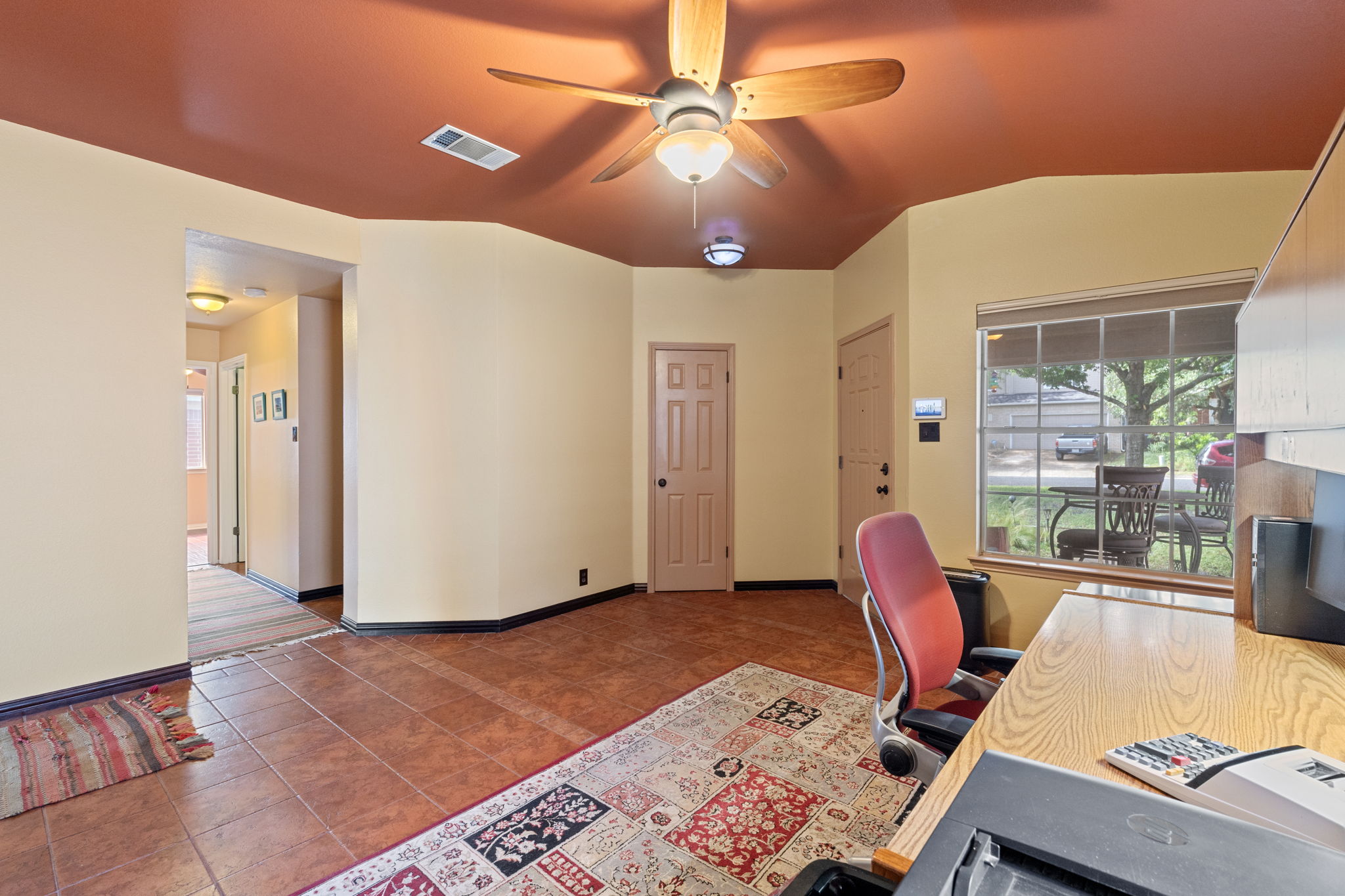 2114 Desco Drive Austin, TX 78748 - Photo 14 of 40 Tiled office with a ceiling fan, plenty of natural light, and baseboards