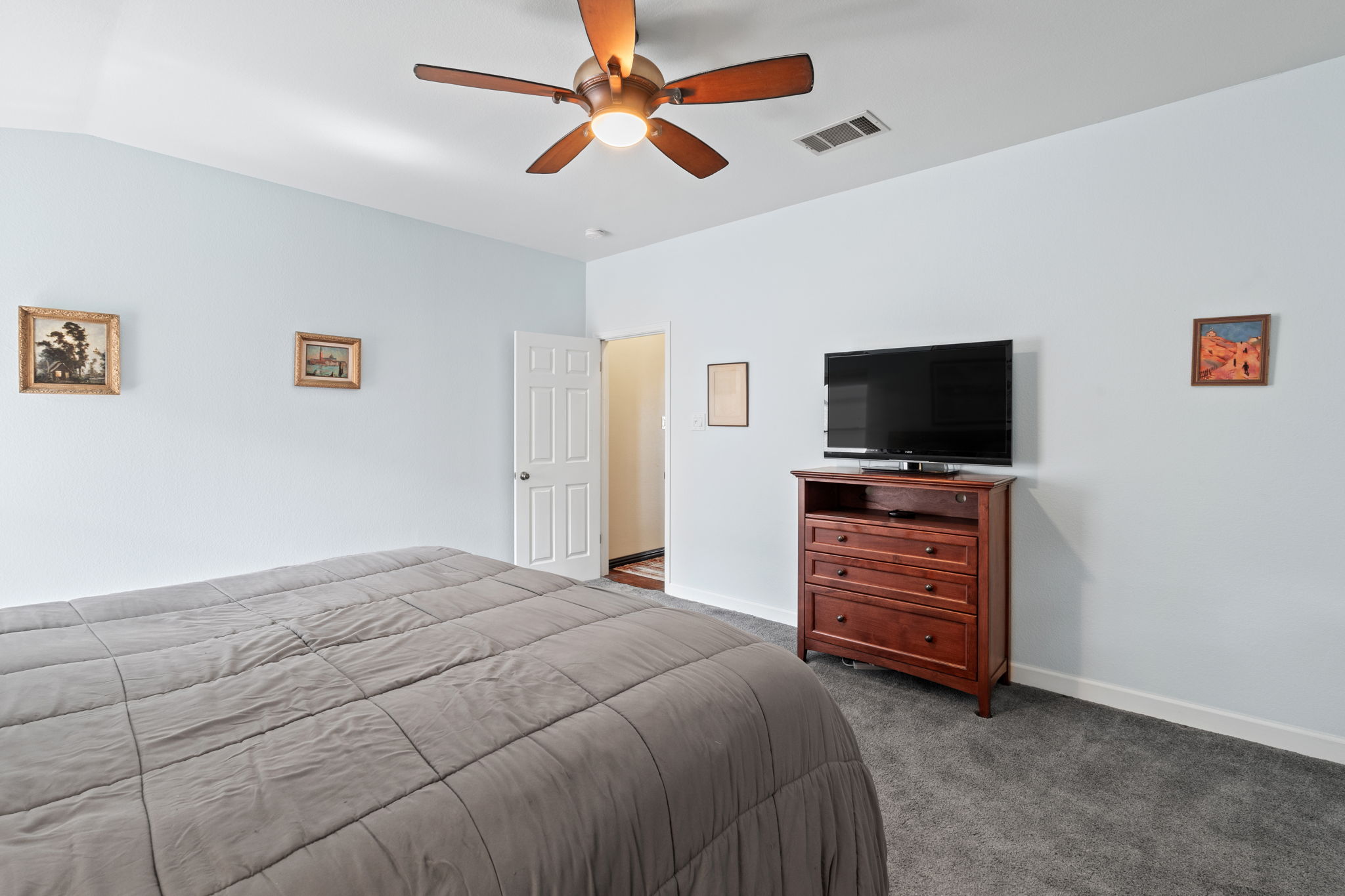 2114 Desco Drive Austin, TX 78748 - Photo 35 of 40 Carpeted bedroom with ceiling fan and baseboards