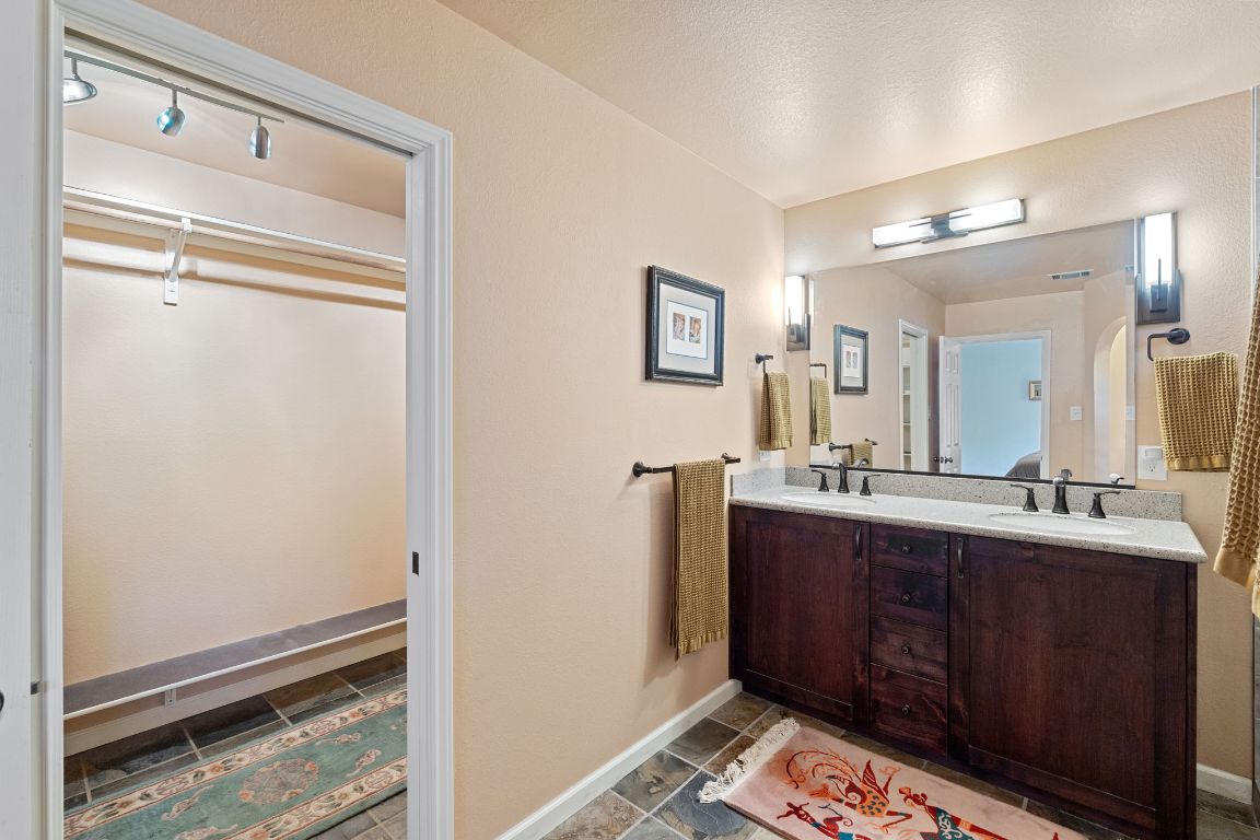 2114 Desco Drive Austin, TX 78748 - Photo 4 of 40 Full bath with double vanity and baseboards