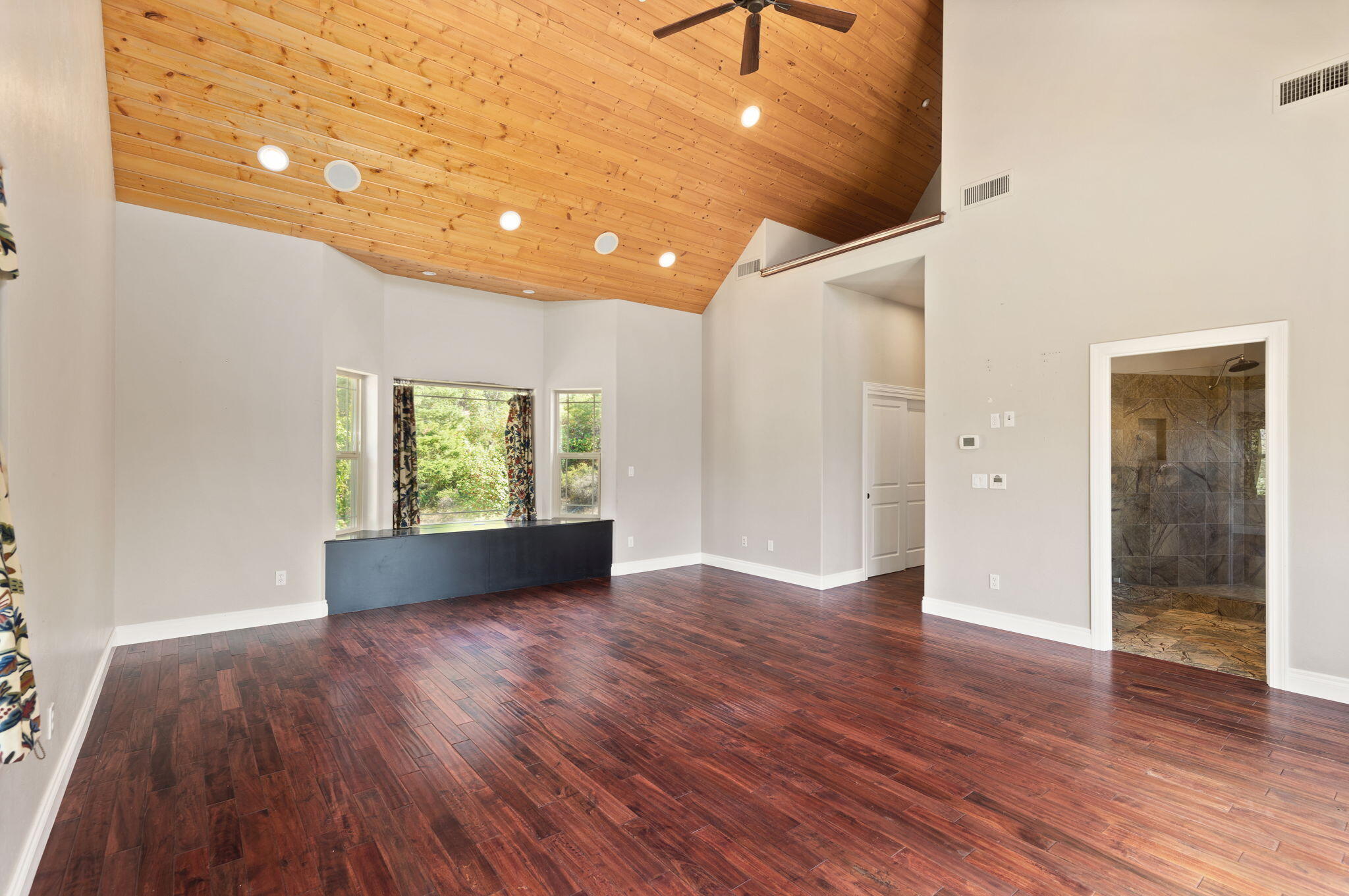 7304 North Applegate Road Grants Pass, OR 97527 - Photo 32 of 87 wooden floor in an empty room with a window